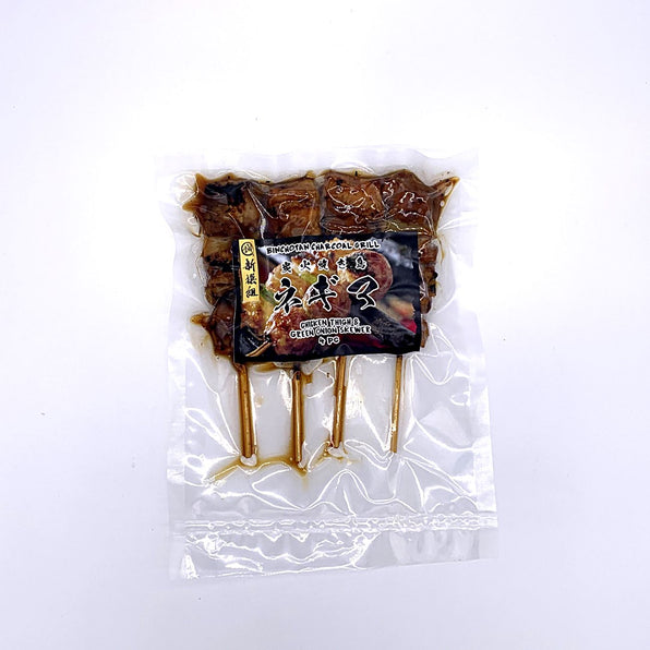 4 skewers of chicken yakitori in vacuum sealed bag with packaging sticker in front.
